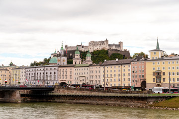 Fototapeta premium Salzburg castle and old town with river on foreground.