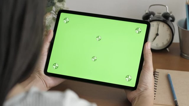 Blank digital tablet in the hands of Asian women, Tablet computer's green screen