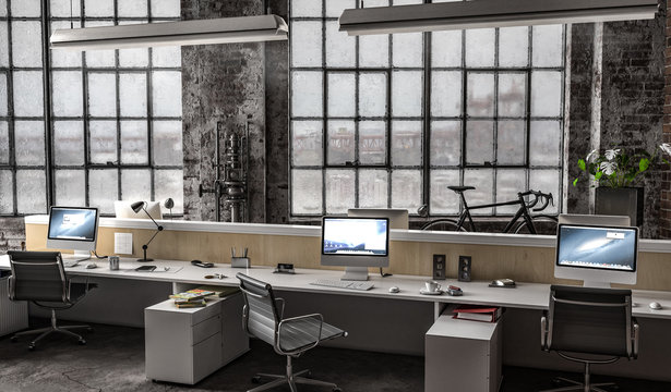 Großraumbüro in Industriehalle mit mehreren Arbeitsplätzen am Tag