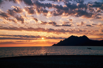 Beautiful golden sunset on a beach in Porto Corsica Corse France