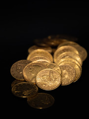 Close up gold money coin stacking on dark background