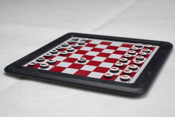 portable chessboard on white background