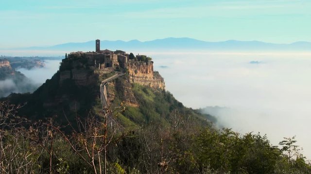 An ancient town (Civita di Bagnoregio) floating  on clouds (time lapse) SF
