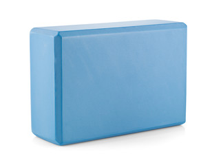 Blue polypropylene yoga cube isolated on white background. Selective focus. Sports and health products.