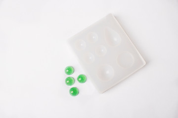 Molding Of Epoxy Resin shaped / Castings DIY Jewelry Making  on white background