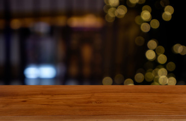 Empty dark wooden table in front of abstract blurred background of cafe and coffee shop interior. can be used for display or montage your products - Image.