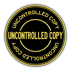 Fototapeta premium Black and gold color round sticker in word uncontrolled copy on white background
