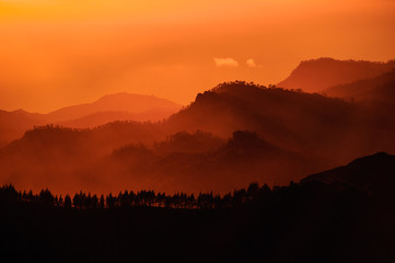 GRAN CANARIA, SPAIN - NOVEMBER 6, 2018: Amazing Roque Nublo mountain in bright orange sunlight in the morning