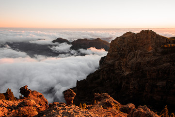 GRAN CANARIA, SPAIN - NOVEMBER 6, 2018: Roque Nublo mountain under the clear sky among white clouds