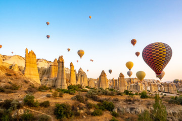 Fototapeta na wymiar balloons on a background of mountains and dawn in Cappadocia