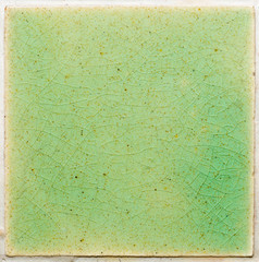 background and texture of stretch marks cracked on emerald green glazed tile