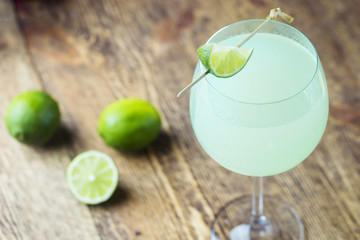 Refreshing green cocktail, summer drink with lime in a glass