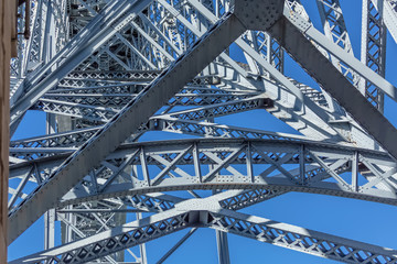 Detailed view at the D. Luis bridge structure, blue sky as background