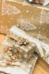 Fototapeta na wymiar Big and small golden christmas gift boxes