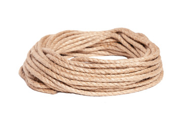 Closeup of rough brown braided rope coiled in the form of ring. Concept equipment, strength, sport, fitness, exercise, workout, strong, training, cord, lifestyle, athlete, activity young people