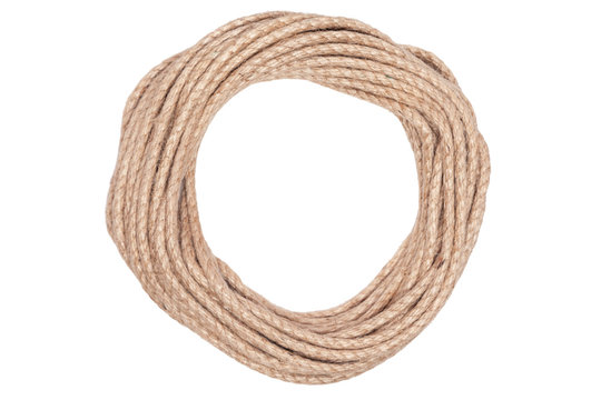 Closeup of rough brown braided rope coiled in the form of ring. Concept equipment, strength, sport, fitness, exercise, workout, strong, training, cord, lifestyle, athlete, activity young people