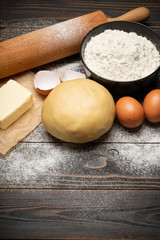 unrolled and unbaked Shortcrust pastry dough recipe on wooden background