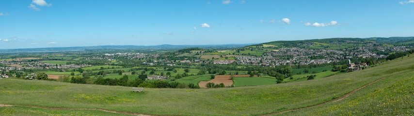 Fototapeta na wymiar Panoramic long distance views from Cotswold Way long distance footpath on Selsley Common near Stroud, Gloucestershire, Cotswolds, UK