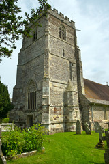 Fototapeta na wymiar The massive 15th-century tower of the church of St Mary and St Bartholomew in rural Cranbourne village, Dorset, England, UK