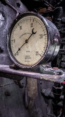 controls and valves in the cabin of an old steam locomotive