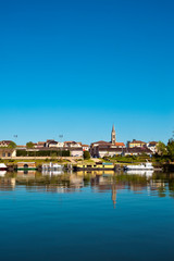 Fototapeta na wymiar The tranquil Lot River at St-Sylvestre-sur-Lot, Lot-et-Garonne,