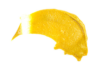 Mustard sauce. Splash of mustard on a white background.