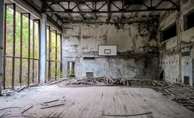 ruined gymnasium in an abandoned school in Chernobyl