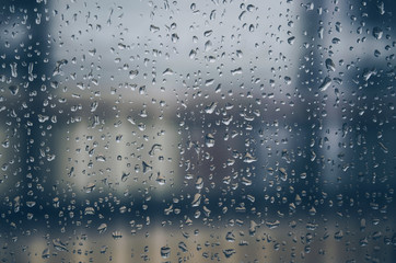 Background and wallpaper by rainy drop and water drops on window glass.