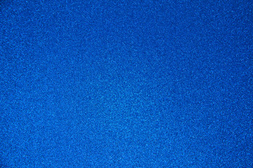 An abstract blue background made of twinkling glitter that is great for a background for Christmas...