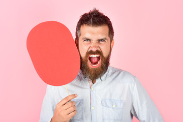 Screaming bearded man hold paper nameplate. Feeling&emotions. Face expression. Fashion, beauty, hairdressing, barber salon. Shouting man with beard&mustache. Blank paper. Evil man with empty name card