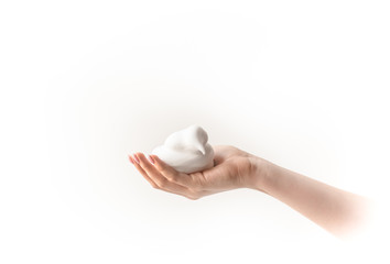 white foam in hand, mousse foam, cloud in hand, foam like snow, holding white lather
