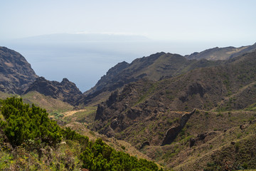 Fototapeta na wymiar Vew of the Teno massif (Macizo de Teno), is one of three volcanic formations that gave rise to Tenerife, Canary Islands, Spain. View from the viewpoint - Mirador Altos de Baracan.