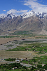 Zanskar valley landscape view from Karsha Gonpa with Himalaya mountains covered with snow and blue sky in Jammu & Kashmir, India,