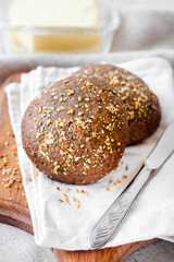 Homemade rye buns with linseeds, sesame and white poppy seeds