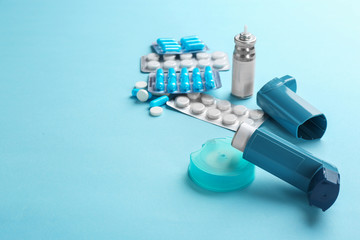 Asthma medications and space for text on color background