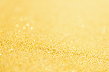 Defocused gold glitter background. Gold abstract bokeh background. Christmas abstract background