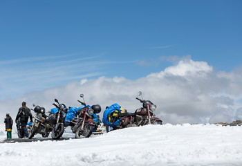 TANGLANG LA PASS, LADAKH , INDIA  JULY 20, 2015: Tourists relaxing  on the summit of the Tanglang La pass is the second highest motorable road in the world at 5400m