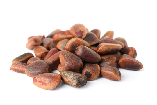 Heap of pine nuts on white background. Healthy snack