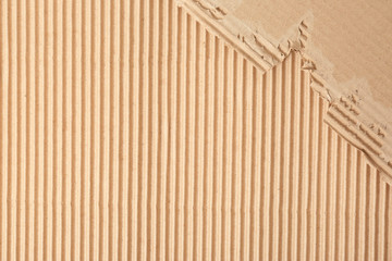 Corrugated cardboard as background, top view with space for text. Recyclable material