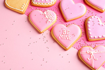 Composition with decorated heart shaped cookies and space for text on color background, top view. Valentine's day treat