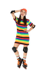 Full length portrait of young woman in bright dress with roller skates on white background
