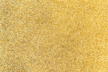 Defocused gold glitter background. Gold abstract bokeh background. Christmas abstract background