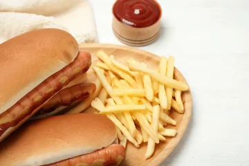Foto op Plexiglas Hot dogs, french fries and sauce on table, closeup © New Africa