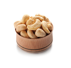 Tasty cashew nuts in bowl isolated on white