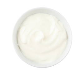 Bowl with sour cream on white background, top view