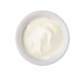 Fototapeta na wymiar Bowl with sour cream on white background, top view