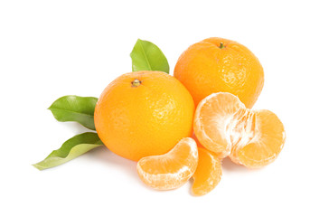Tasty ripe tangerines with leaves on white background