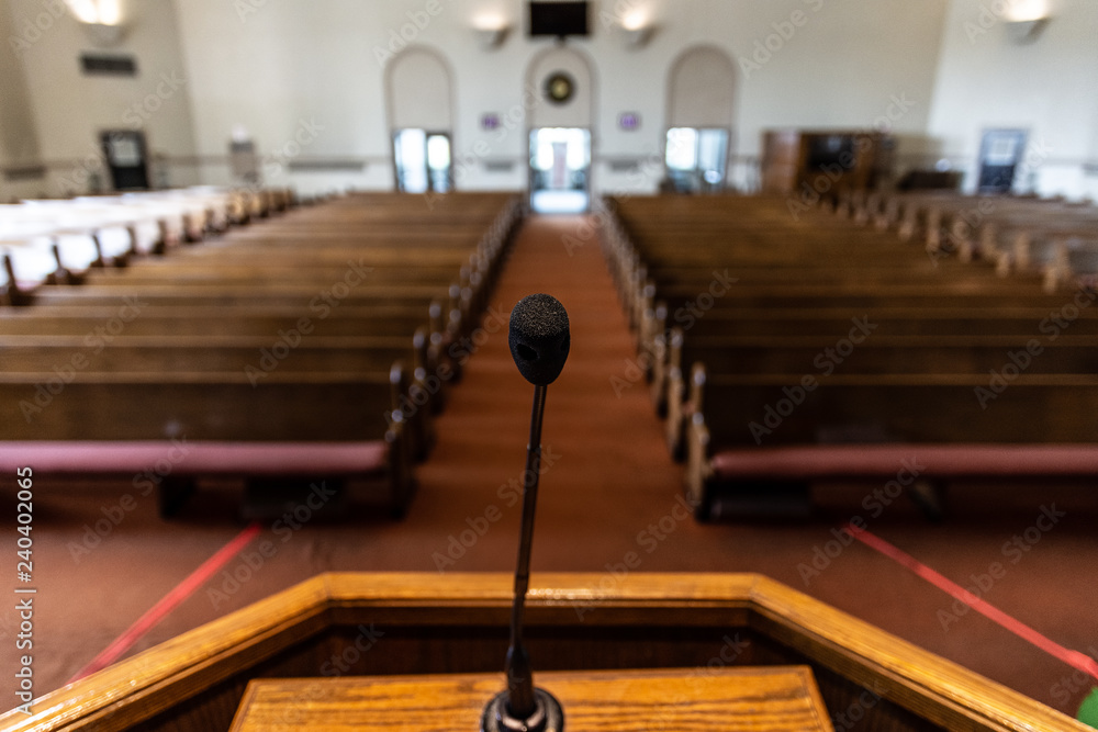 Wall mural empty church sanctuary view from the pulpit and microphone