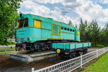 Narrow-gauge locomotive TU-169 on the pedestal.