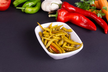 pickled peppers in a plate